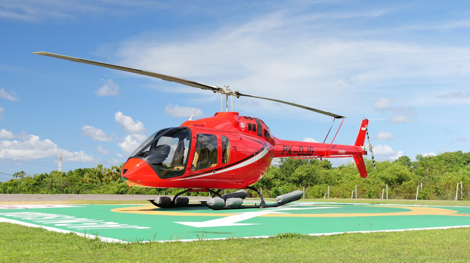 Bell 505 helicopter on a Bali helipad